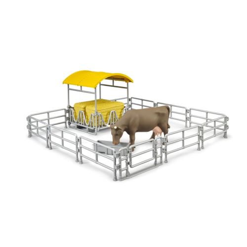Mangeoir et clôture avec vache