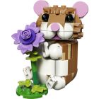 Le hamster mignon avec une fleur